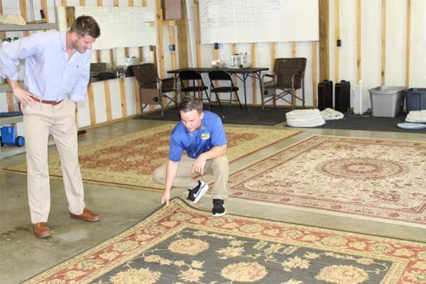 Client being shown safedry method for cleaning carpets