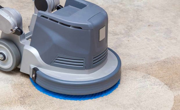 professional-carpet-cleaner-with-equipment-on-carpet